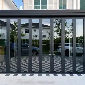Black Aluminum Folding Doors with Tinted Glass Enclosing the Front Home Garage, Installed by SGQ